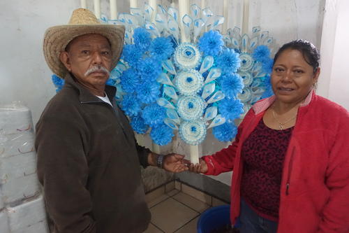 Sacrifices: Juan Ventura and Eustolia Tomas with their altar candles, July 2016